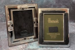 A silver mounted Art Deco style picture frame, embossed in relief border, wood backed, 13cms high,