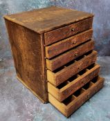 An early 20th century watchmaker's or collector's bank of six graduated pine drawers, 35cm high x