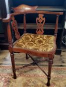 An Edwardian Sheraton Revival corner chair, X-frame stretcher c.1910