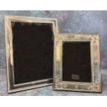 A silver mounted picture frame, embossed in relief border, wood backed,23.5cms high, Ron Carr,