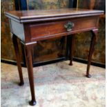 A George II mahogany tea table, brass mounted hinged top above a single drawer to frieze, raised