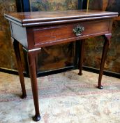 A George II mahogany tea table, brass mounted hinged top above a single drawer to frieze, raised