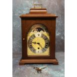 A Hermle mahogany mantel clock, 8-day 4/4 Westminster striking mechanism with automatic night shut-