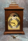 A Hermle mahogany mantel clock, 8-day 4/4 Westminster striking mechanism with automatic night shut-