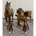 A Beswick bay mare, off fore raised, 15.5cm high;  another;  a Beswick foal;  others, Royal