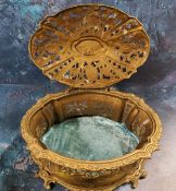 An early 20th-century gilt metal waisted oval pierced casket, the slightly domed cover with