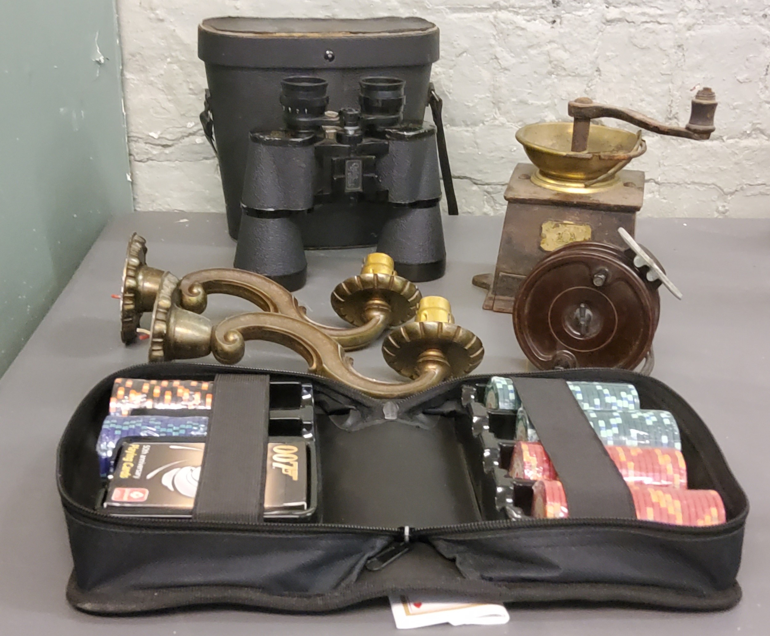 An Allcock Ariellite bakelite reel;  a coffee grinder;  Greenkat binoculars, 10 x 50, cased;  007