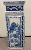 A modern Chinese blue and white panelled square vase, each side decorated with a monumental