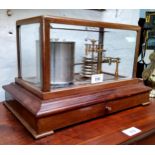 A Cassella of London barograph, marked 891 twelve diaphragm bellows, cased in bevelled glass,