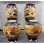 A pair of Noritake Bedouin pattern ovoid vases, decorated with Egyptian scenes of an Arab, camel,