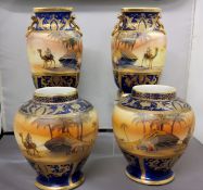 A pair of Noritake Bedouin pattern ovoid vases, decorated with Egyptian scenes of an Arab, camel,