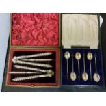 A set of six silver coffee spoons, coffee bean terminals, Birmingham 1927, cased;  a pair of