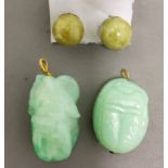 A pair of Jade ear studs;  a Jade scarab pendant;  another  (3)