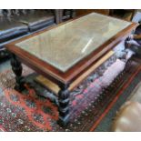 A 20th century mahogany glass topped coffee table, rattan inset panels with acanthus carved