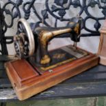 An early 20th century cased Singer sewing machine