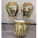 A pair of Noritake ovoid vases, decorated with panels of fanciful birds, in tones of green and gilt,