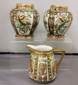 A pair of Noritake ovoid vases, decorated with panels of fanciful birds, in tones of green and gilt,