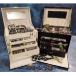 Two large four-drawer jewellery boxes containing costume jewellery including 'Whitby Jet' bead