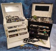 Two large four-drawer jewellery boxes containing costume jewellery including 'Whitby Jet' bead