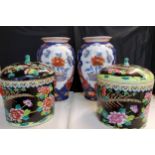 A pair of cylindrical jars and covers,  painted with fanciful birds and chrysanthemums in colours on