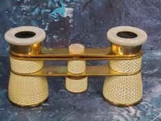 A set of 19th century yellow enamelled and gilt metal opera glasses, 9cm long, c.1870