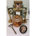 A pair of 19th century brass ejector candlesticks;  other decorative candlesticks;  a copper kettle;