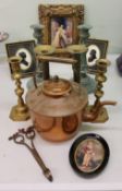 A pair of 19th century brass ejector candlesticks;  other decorative candlesticks;  a copper kettle;