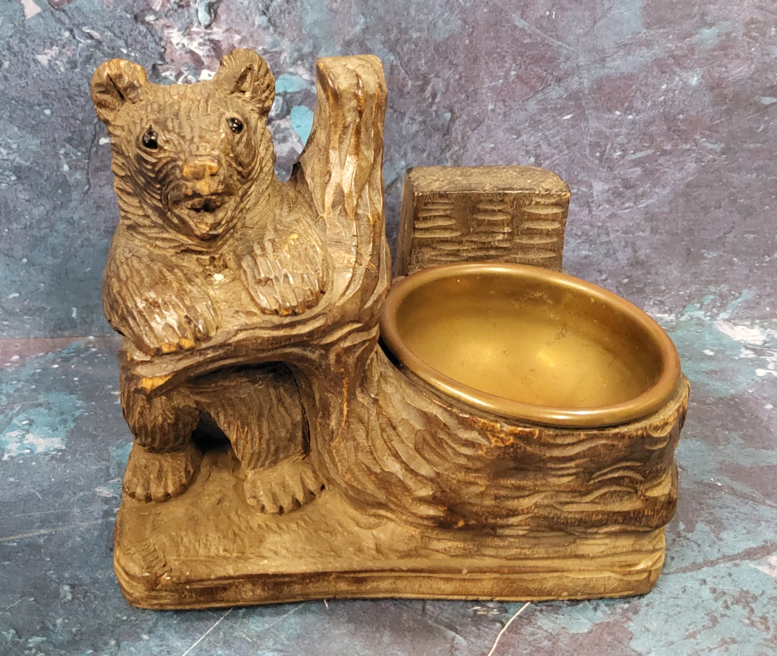 An early 20th century Black Forest bear pin tray, 10cm high, 11cm wide, c.1900