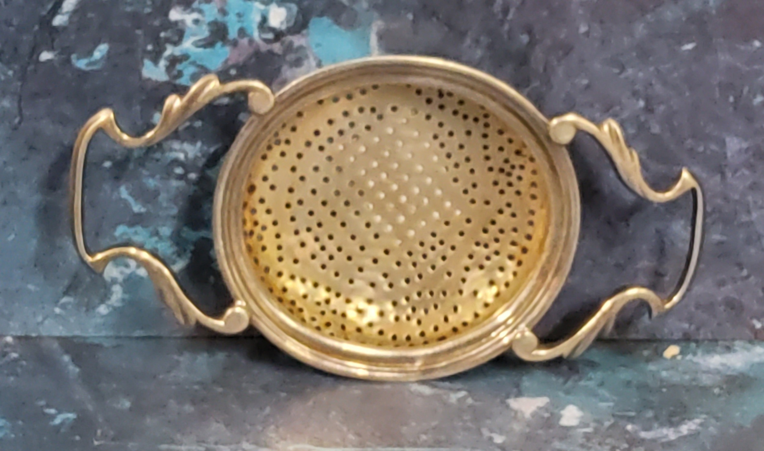 A George III silver lemon strainer, Sheffield rubbed marks, c.1820, 1.2toz