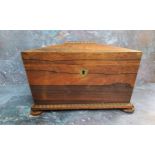 A George III rosewood sarcophagus shaped tea caddy, loose ring handles to sides, gadrooned