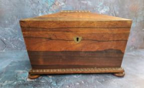 A George III rosewood sarcophagus shaped tea caddy, loose ring handles to sides, gadrooned