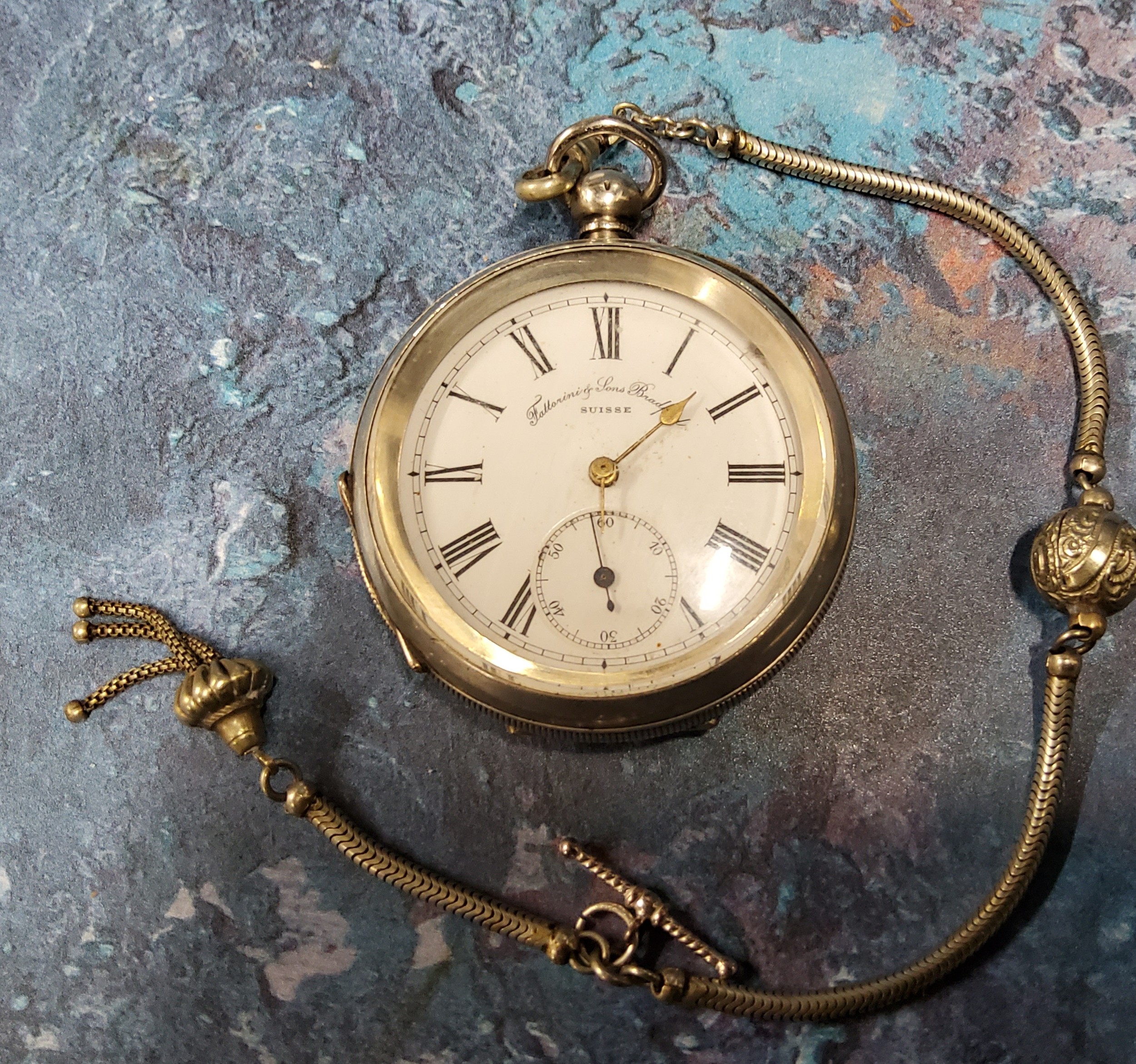 A silver open-faced pocket watch, Roman numerals, inscribed Fattorini & Sons, Bradford; white