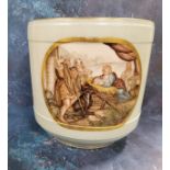 A late 19th century jardiniere, painted with a nativity scene, within a gilt oval cartouche on a