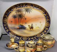 A Noritake Bedouin pattern dressing table tray, and a ring holder, each decorated with Egyptian