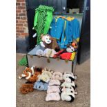 A theatre's costume storage box with various masks, capes and clothing