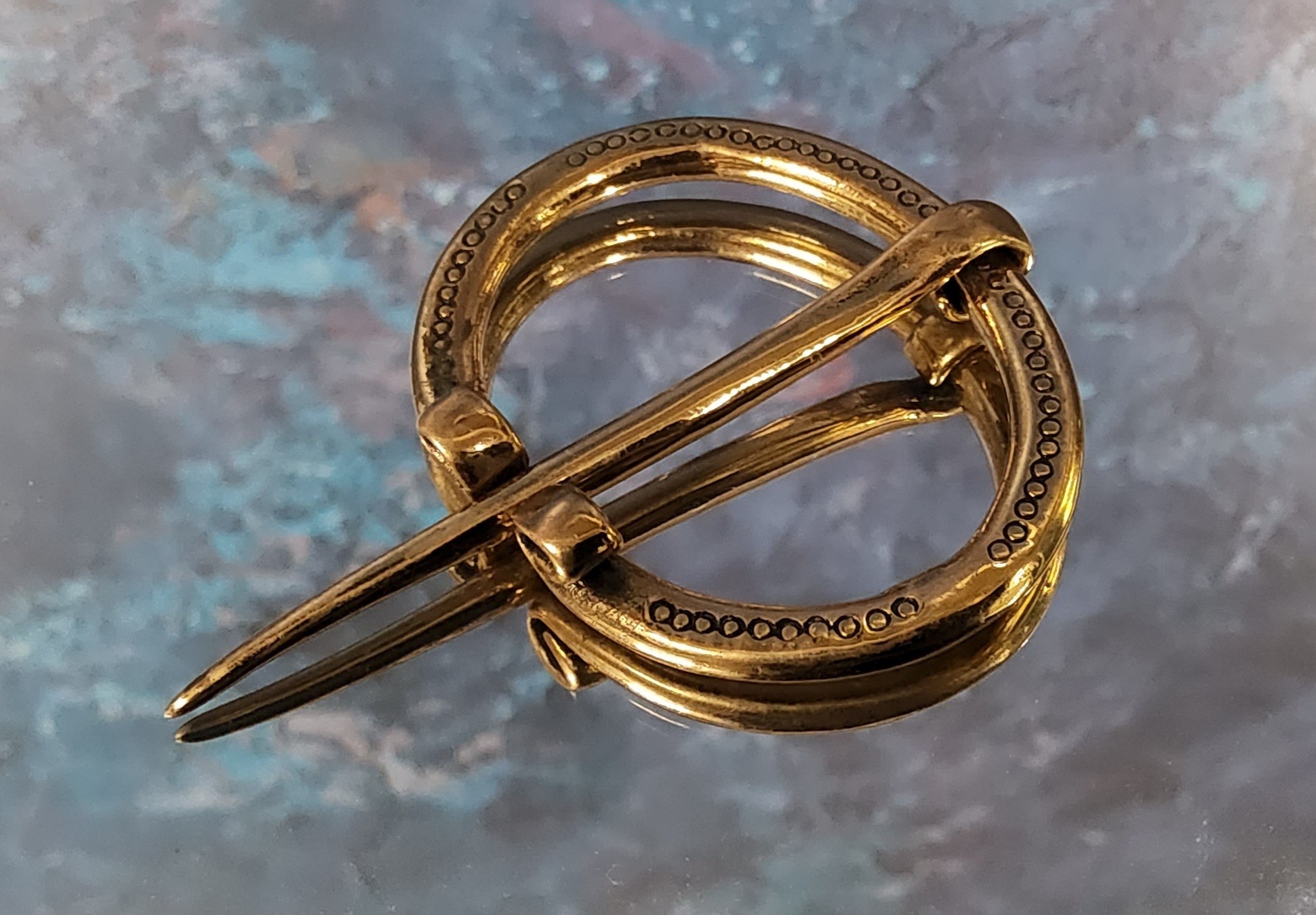 A bronze penannular brooch