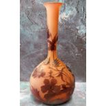 An Art Glass ovoid bottle vase, etched with stylised flowers, on a mottled red ground, bears