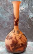 An Art Glass ovoid bottle vase, etched with stylised flowers, on a mottled red ground, bears
