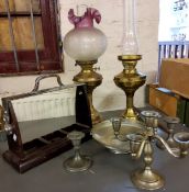 A Victorian style brass oil lamp and glass shade;  a similar brass oil lamp base;  a tantalus stand;