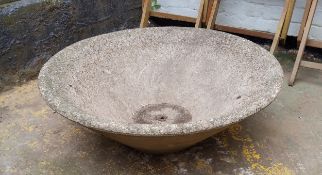 A substantial reconstituted stone dished planter