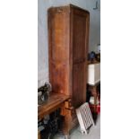 A 19th century pine school cupboard