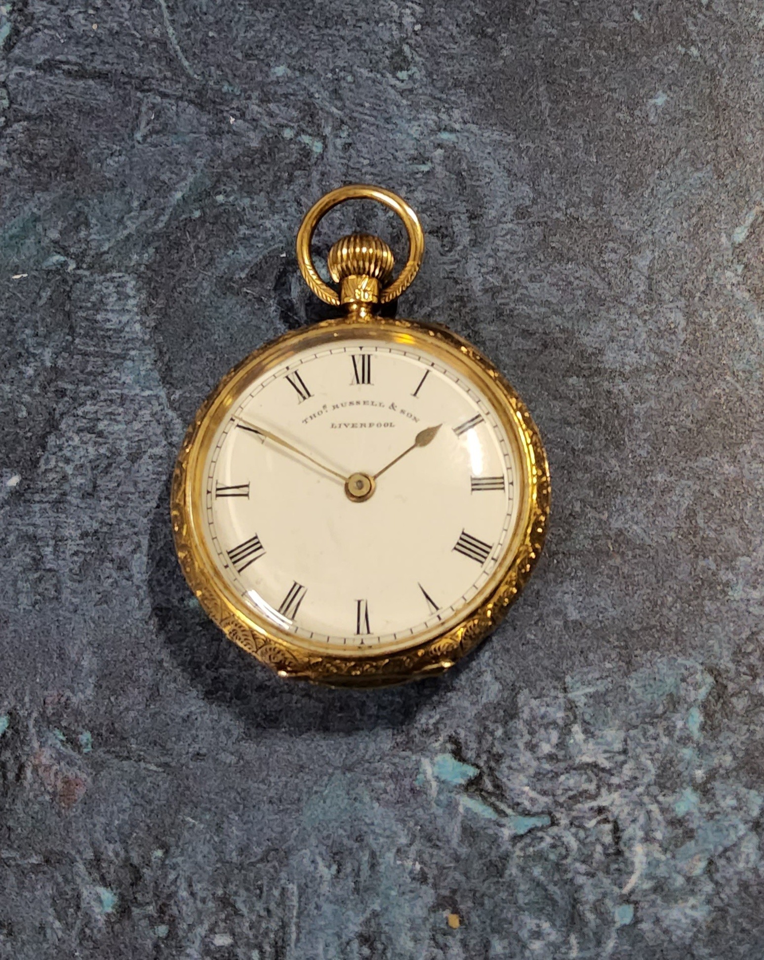 A Victorian 18ct gold open faced lady's keyless pocket watch, the case chased & engraved, vacant