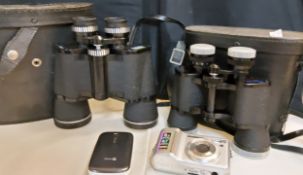 A Halina binoculars 12 x 50, cased;  Omiya binoculars, 8 x 40;  a Doro 6520 folding mobile phone,