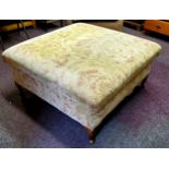 A footstool with Aubusson type upholstery of country house proportions, beech legs, 93cm square seat