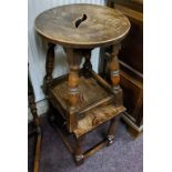 An early 20th century oak stool; small oak occasional table (2) (A/F)