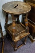 An early 20th century oak stool; small oak occasional table (2) (A/F)
