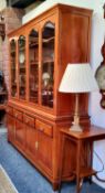 A Chinese hardwood mirrored back display cabinet, glazed doors with toughened glass shelves, 177cm