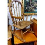 A child's beech spindle back rocking chair