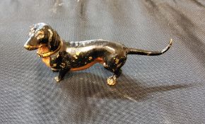 Austrian School, a cold painted bronze, of a Dauschund, 8cm lomg