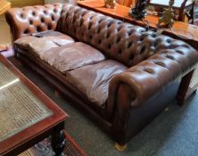 A three seater Chesterfield sofa (later wooden feet)